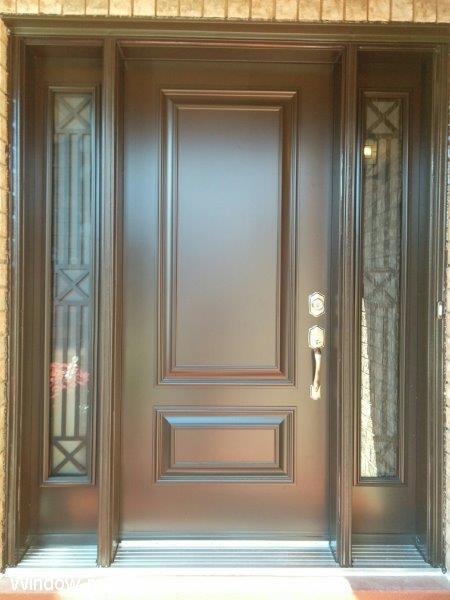 Contemporary front door ideas. Two executive panels raised. Single exterior entry insulated. Two sidelights contemporary Century wrought iron glass inserts. Brown